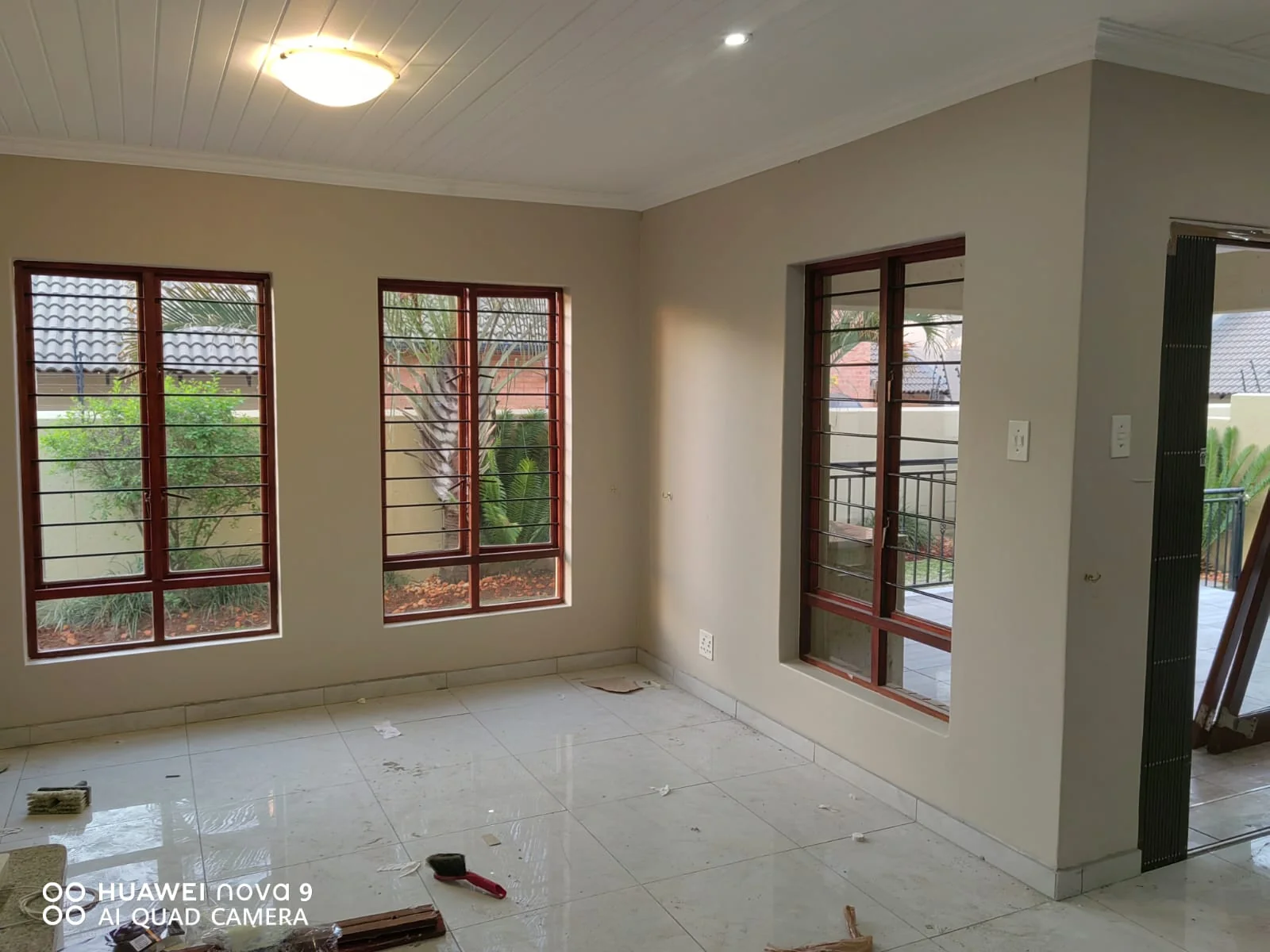 Professional interior painting showing a beautifully finished living room with elegant wall colours